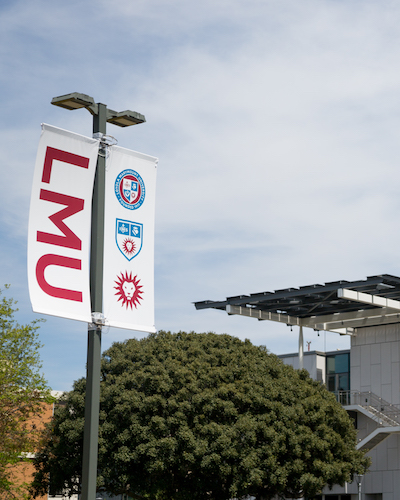 LMU flags in front of Life Science Building